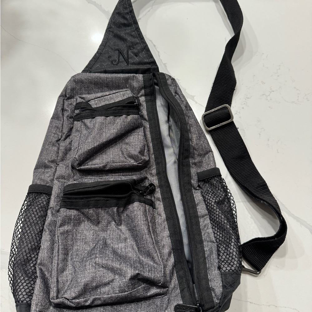 Gray Thirty-One crossbody bag with embroidered N